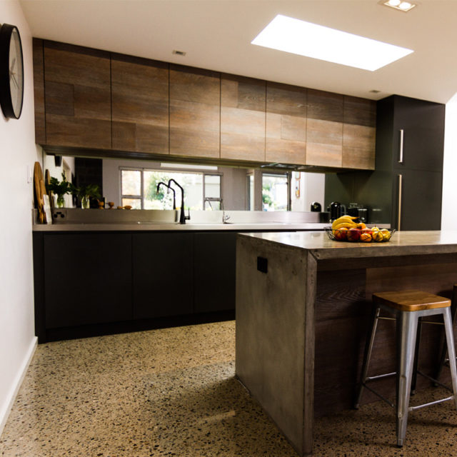 Kitchen cabinet with Concrete island bench
