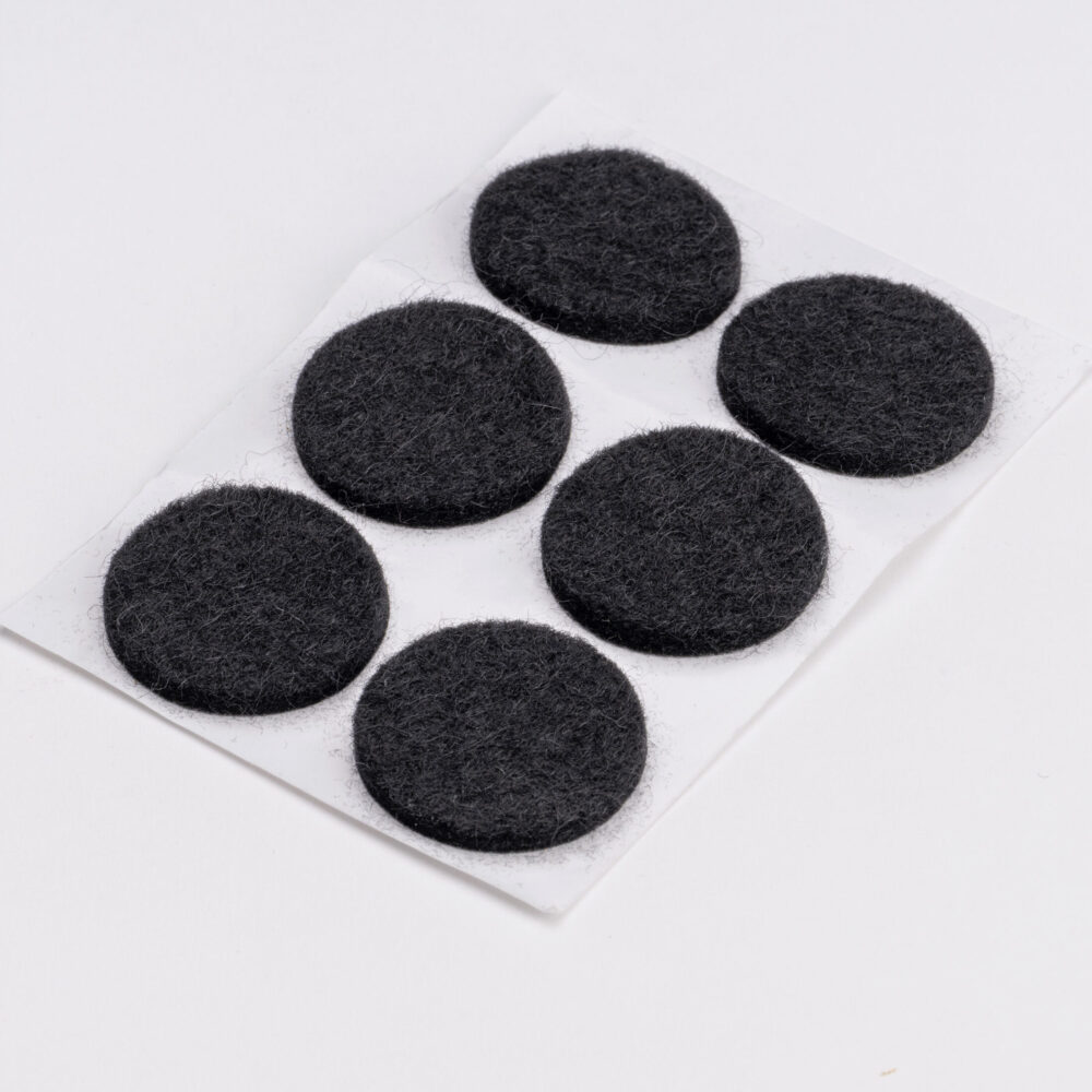 Adhesive backed felt disc.
