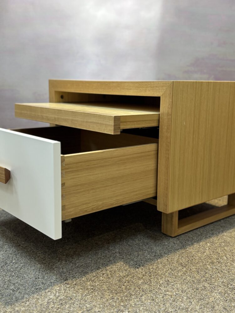 Adelaide, South Australian made oak timber bedside table with drawer and hidden shelf. Side view of drawer and shelf