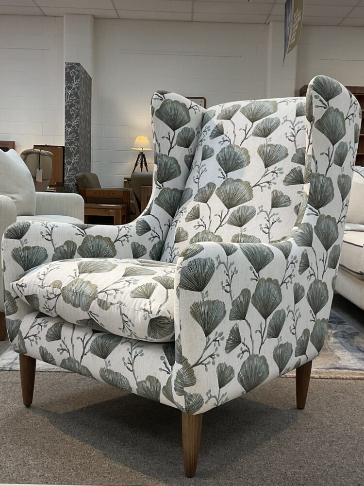 Molmic, Melbourne made fully pattern upholstered occasional chair with timber legs. View of side