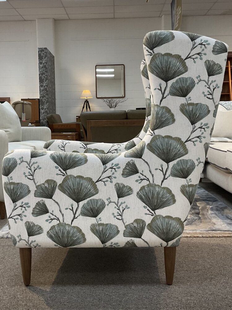 Molmic, Melbourne made fully pattern upholstered occasional chair with timber legs. View of side