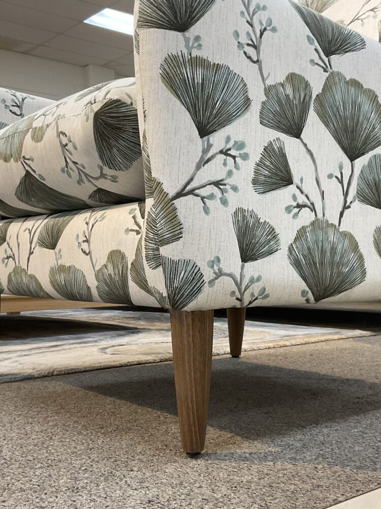 Molmic, Melbourne made fully pattern upholstered occasional chair with timber legs. View of legs