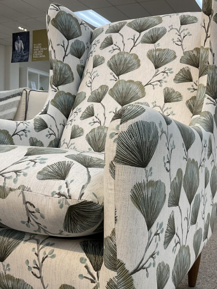 Molmic, Melbourne made fully pattern upholstered occasional chair with timber legs. View of arm