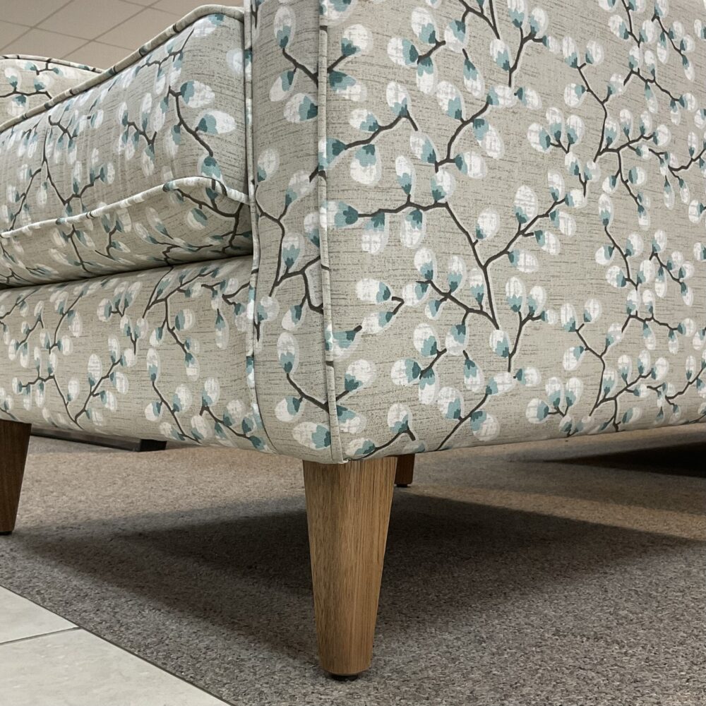 Molmic, Melbourne made fully pattern upholstered occasional chair with timber legs. View of legs