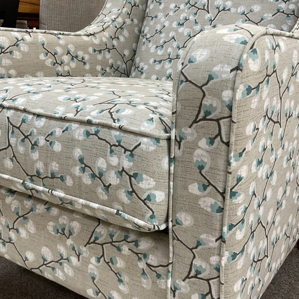 Molmic, Melbourne made fully pattern upholstered occasional chair with timber legs. View of arm