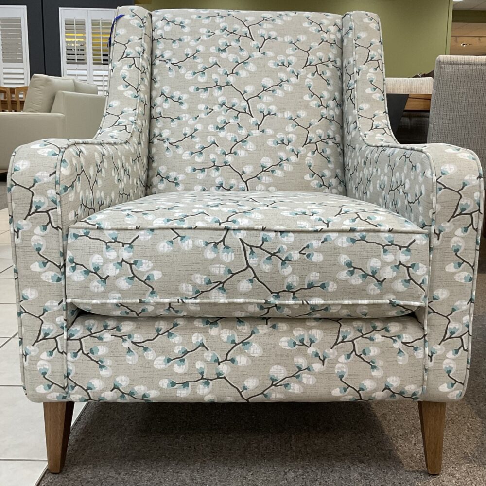 Molmic, Melbourne made fully pattern upholstered occasional chair with timber legs. View of front