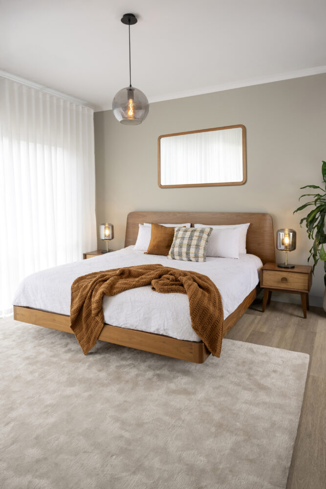 Adelaide, South Australian made solid walnut timber floating bed with curved bedhead. View of front