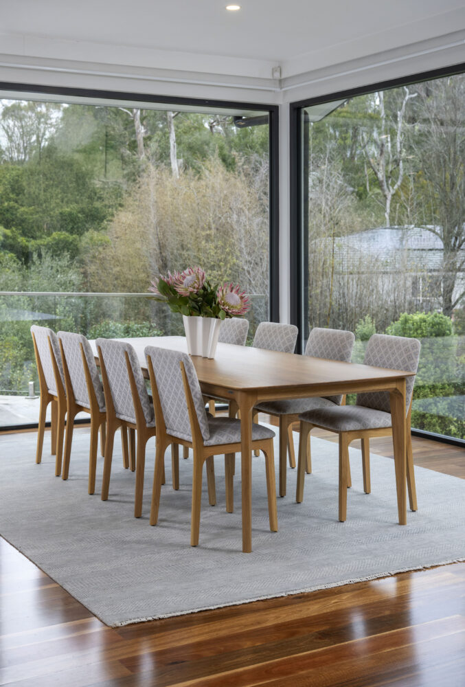 Adelaide, South Australian made solid American Oak timber dining table and upholstered chairs.