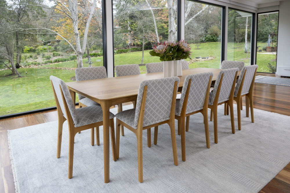 Adelaide, South Australian made solid American Oak timber dining table and upholstered chairs.