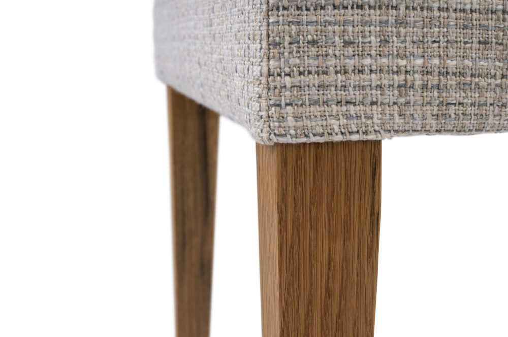 Adelaide, South Australian made solid timber Henley dining chair upholstered in fabric, view of leg detail.