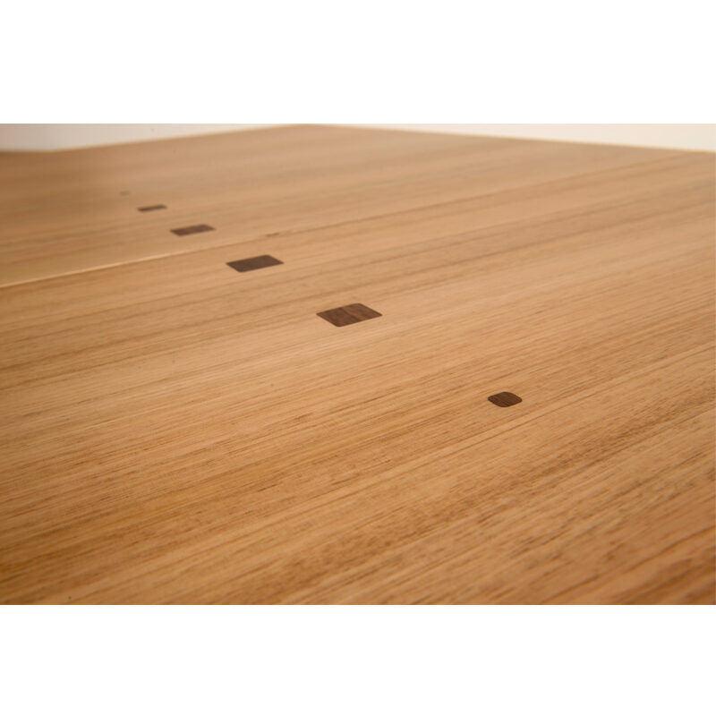 Inlaid timber squares are a feature of the allegro dining table.